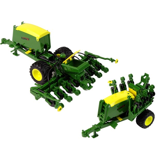 Blue tractor with baler